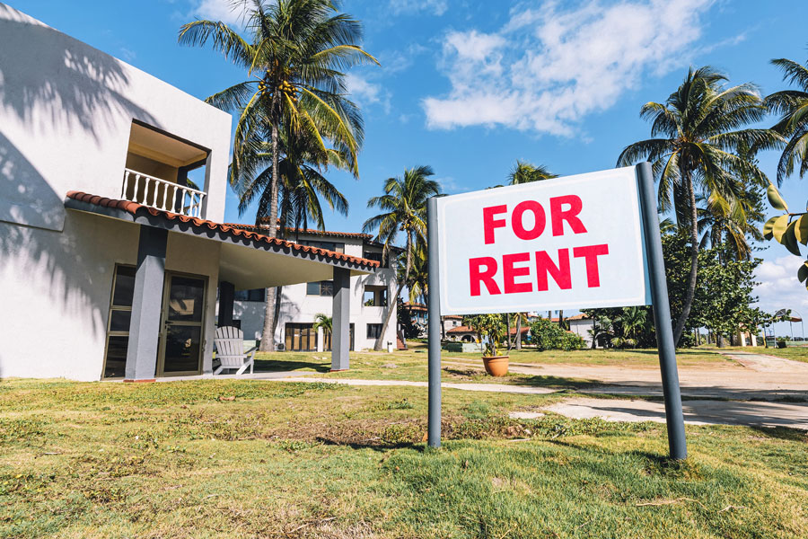 For Rent sign in front of apartment complex